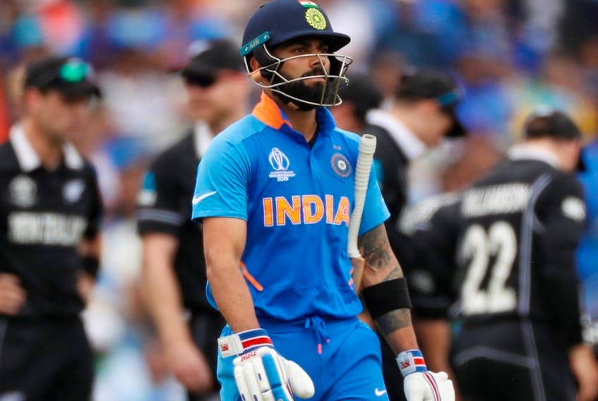 India's Virat Kohli reacts after losing his wicket during a Cricket World Cup semifinal game against New Zealand in Manchester, England, on July 10, 2019. (LEE SMITH/Reuters)