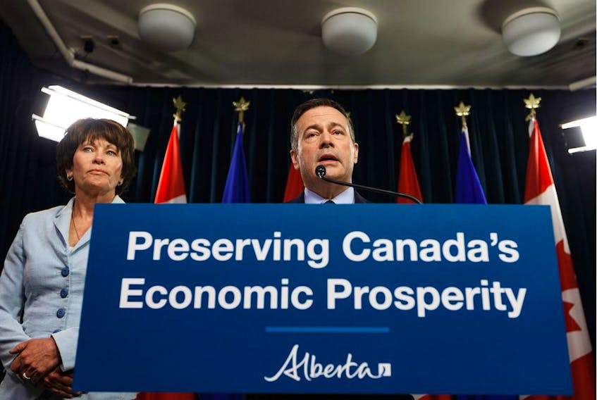 Premier Jason Kenney speaks beside Energy Minister Sonya Savage, left, about Bill 12, the turn-off-the-taps legislation, during a news conference in the media room in the Alberta legislature in Edmonton, on Wednesday, May 1, 2019.