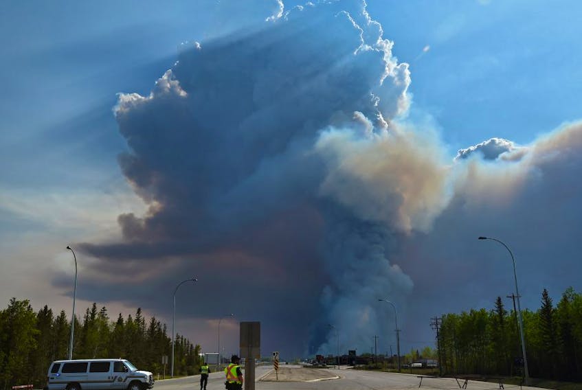 Wildfire crews conduct a controlled burn ignition operation on Wednesday May 22, 2019, approximately three kilometres southwest of High Level where about 4,000 residence were evacuated from the Chuckegg Creek fire.