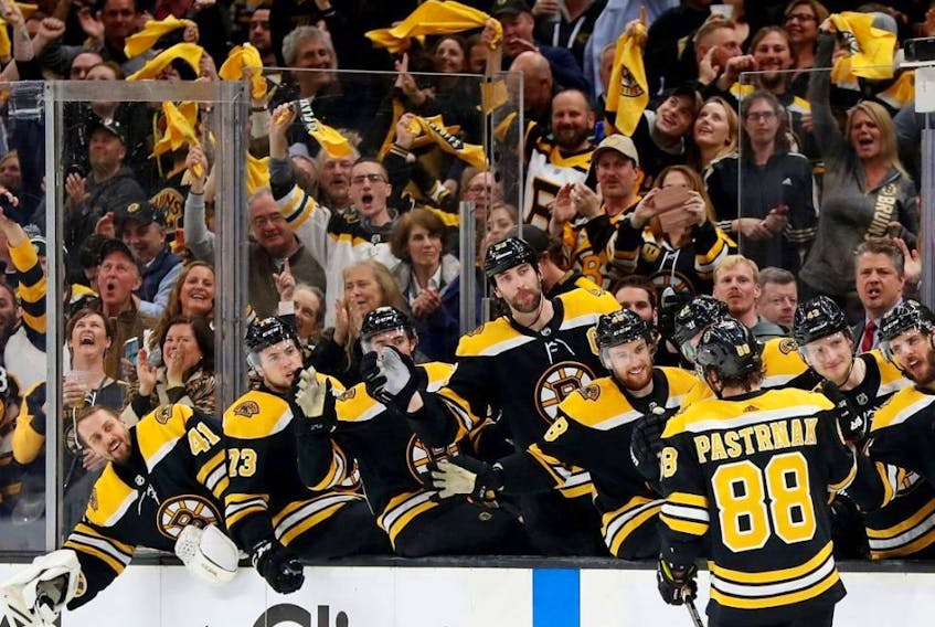 Bruins forward David Pastrnak celebrates with teammates after scoring a goal against the Blue Jackets during the third period of Game 5 of the Eastern Conference Second Round playoff series at TD Garden in Boston on Saturday, May 4, 2019.