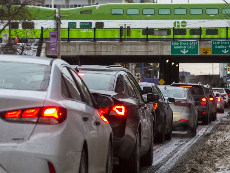 A GO train above vehicles lining up on Jarvis St. to exit onto the Gardinder Expressway ramp during the evening rush hour in Toronto, Ont.  on Tuesday January 22, 2019. 