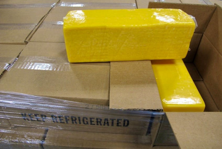 In this photo provided by the Canada Border Services Agency, officials seized 3,990 kilograms of undeclared cheese at the Thousand Islands border crossing on Jan 10, 2018. The driver was charged with a $30,000 fine.