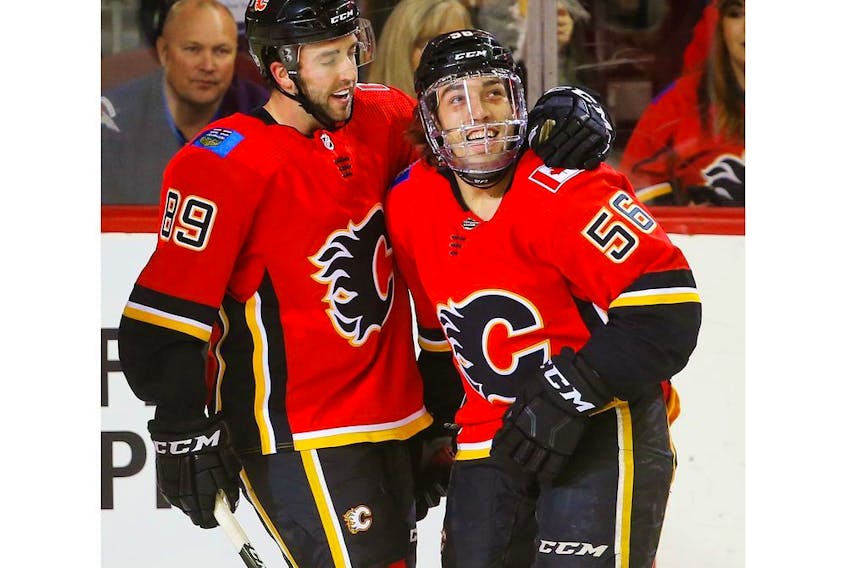  Calgary Flames No. 1 line Sean Monahan, Elias Lindholm and Johnny Gaudreau celebrate a goal.