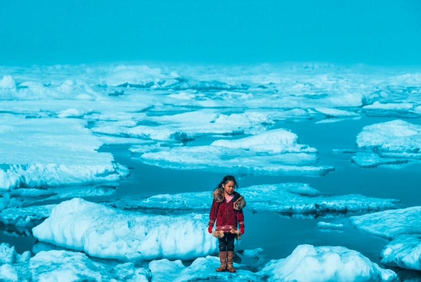  On July 1, 2016, an Iñupiat girl Amaia, 11, stands on a ice floe on a shore of the Arctic Ocean in Barrow, Alaska. The anomalous melting of the Arctic ice is one of the many effects of global warming that has a serious impact on the life of humans and wildlife.