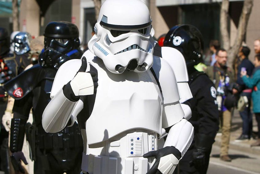  A StormTrooper gives a thumbs up during the annual Parade of Wonders that kicks off the 2019 Calgary Comic Expo Friday, April 26, 2019. Dean Pilling/Postmedia