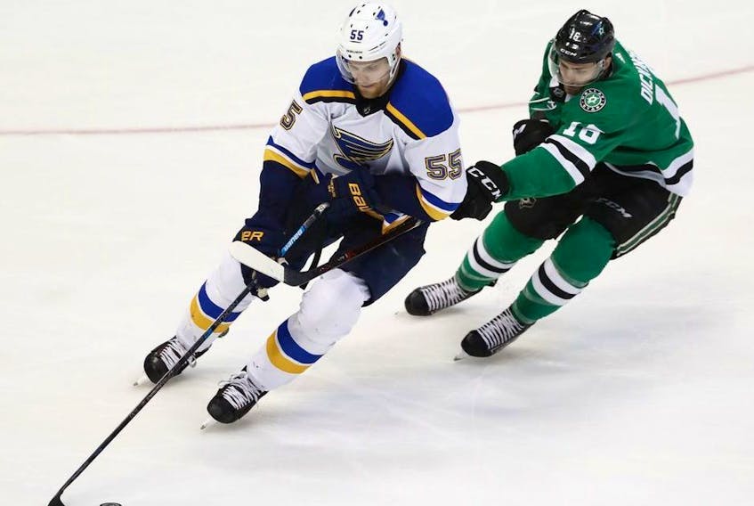 St. Louis Blues' Colton Parayko handles the puck as Dallas Stars' Jason Dickinson defends during the third period in Game 4 of an NHL second-round hockey playoff series, Wednesday, May 1, 2019, in Dallas.