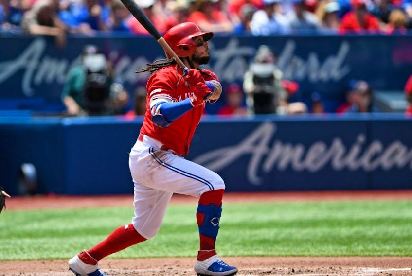 Blue Jays shortstop Freddy Galvis hits his second home run of the game in the third inning against the Royals at Rogers Centre in Toronto on Canada Day, Monday, July 1, 2019.