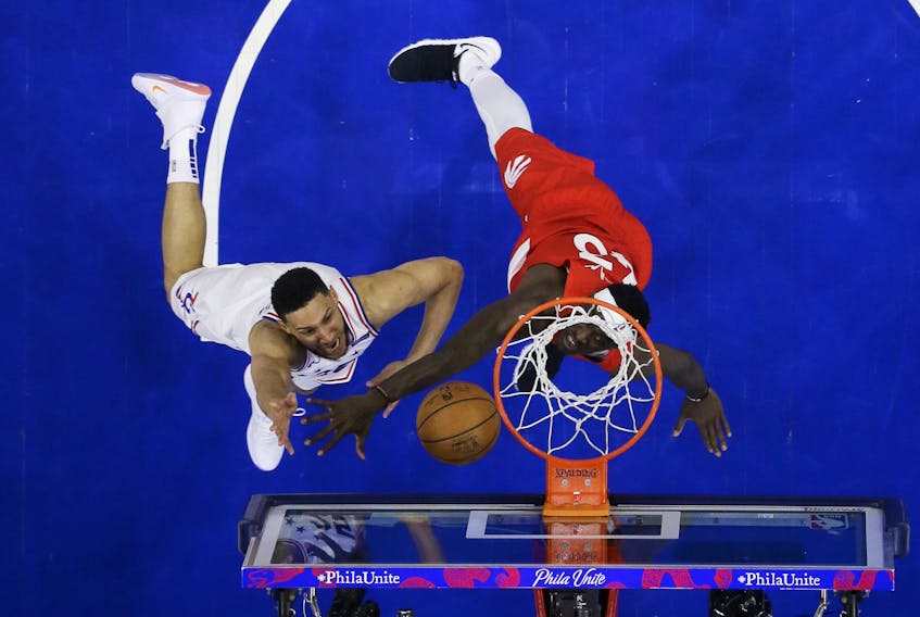 76ers’ Ben Simmons (left) goes up for a shot against Raptors’ Pascal Siakam during the second half of Game 6 on Thursday night in Philadelphia. (AP PHOTO)