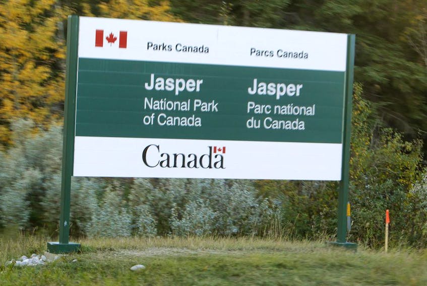 A sign is posted just west of the Jasper National Park gates on highway #16 on Wednesday Oct. 1, 2013. Tom Braid/Edmonton Sun/QMI Agency
