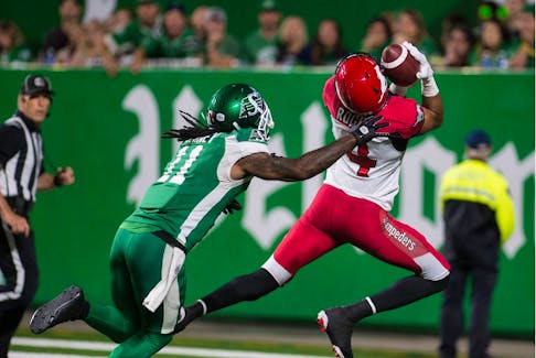 Eric Rogers, 4, of the Calgary Stampeders catches a touchdown pass against the Saskatchewan Roughriders' Ed Gainey on Saturday at Mosaic Stadium. 