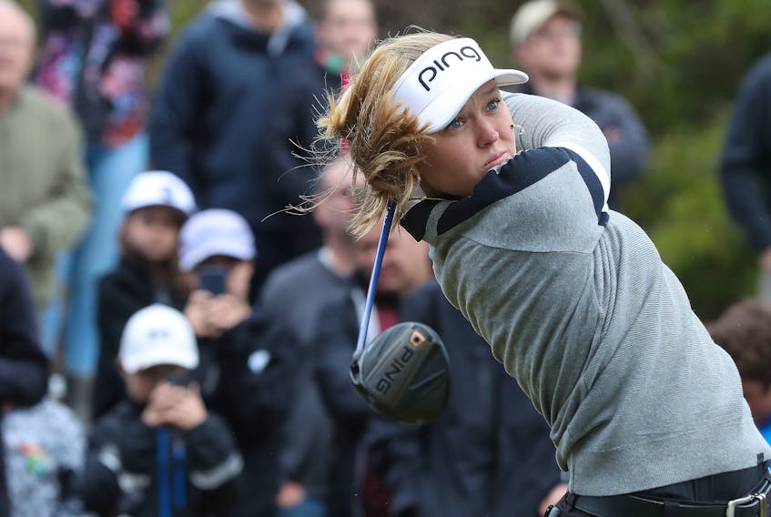 LPGA Tour star Brooke Henderson hits some balls during a demonstration for kids at the Eagle Creek Golf Club in Dunrobin, Ont., on Tuesday. Henderson was attending the Kevin Haime Kids to the Course Classic.
