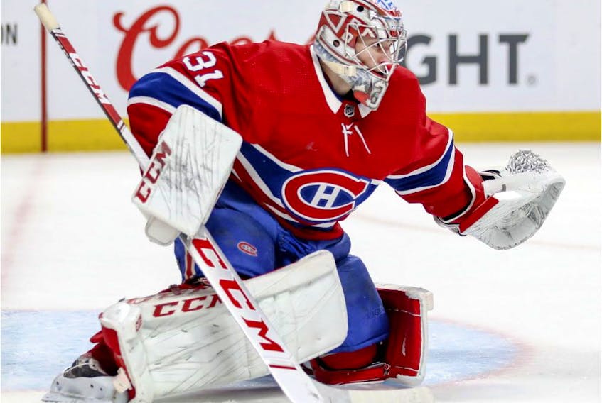 Montreal Canadiens' Carey Price slides across the crease during second period against the New York Islanders in Montreal on March 21, 2019. 