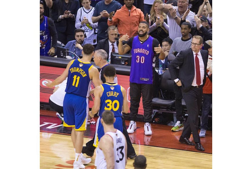 Klay Thompson gets grief from Drake after a foul call in the 4th quarter  as  the Toronto Raptors beat the Golden State Warriors in Game 1 of the NBA Finals in Toronto. on Friday May 31, 2019. Stan Behal/Toronto Sun/Postmedia Network