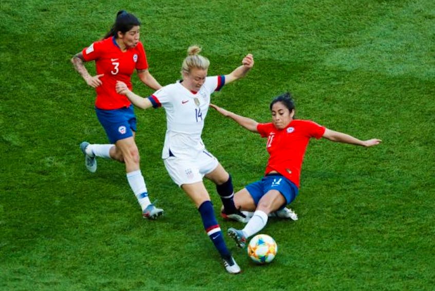  Emily Sonnett of the U.S., centre, in action against Chile’s Carla Guerrero and Yessenia Lopez during the Women’s World Cup Group F match at Parc des Princes in Paris on Sunday, June 16, 2019. (Gonzalo Fuentes / Reuters)