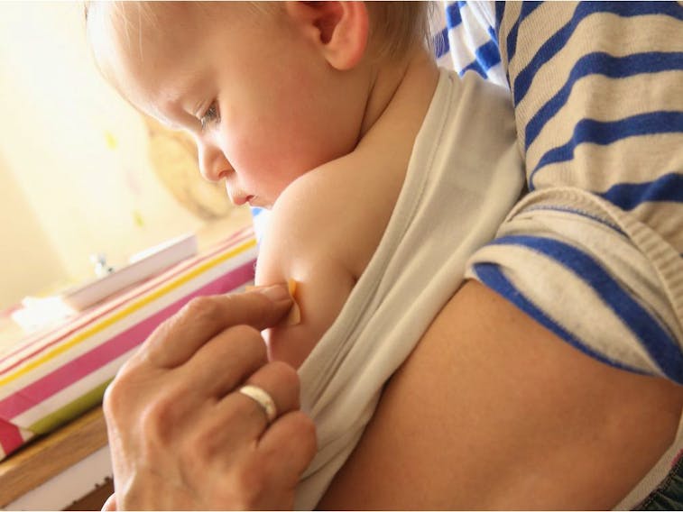 A doctor's assistant applies a Band-Aid after giving a vaccination to an 11-month-old child in Berlin, Germany in 2015: "While most diseases are more severe if you get them as an adult, hepatitis B is paradoxically worse if you get it young," Christopher Labos writes.
