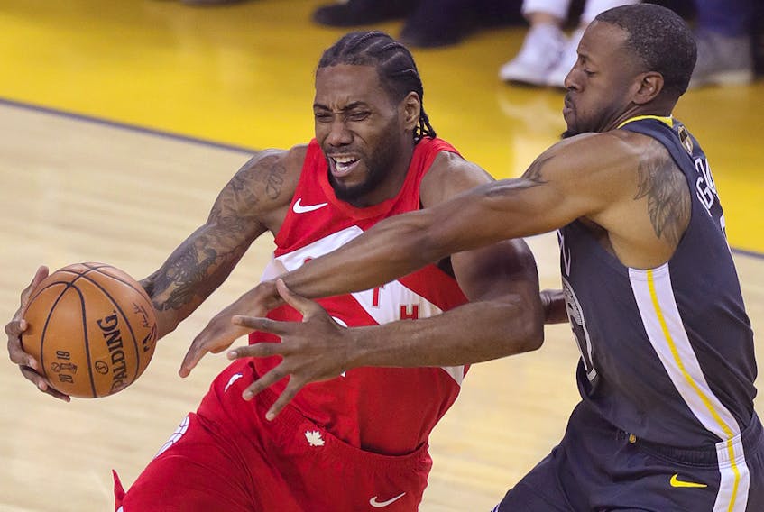Toronto Raptors forward Kawhi Leonard (2) drives to the basket while Golden State Warriors forward Andre Iguodala (9) defends during Game 4 of the NBA Finals at Oracle Arena. (Sergio Estrada-USA TODAY Sports)