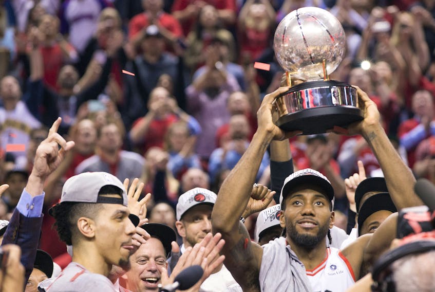  Kawhi Leonard holds up the Eastern Conference Championship trophee after The Raptors beat the Milwaukee Bucks on Saturday May 25, 2019.
