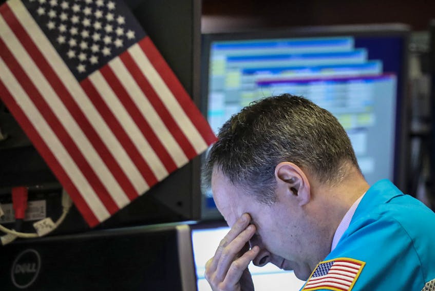 A trader works in the NYSE as markets plunged this month on increased trade tensions between U.S. and China. 