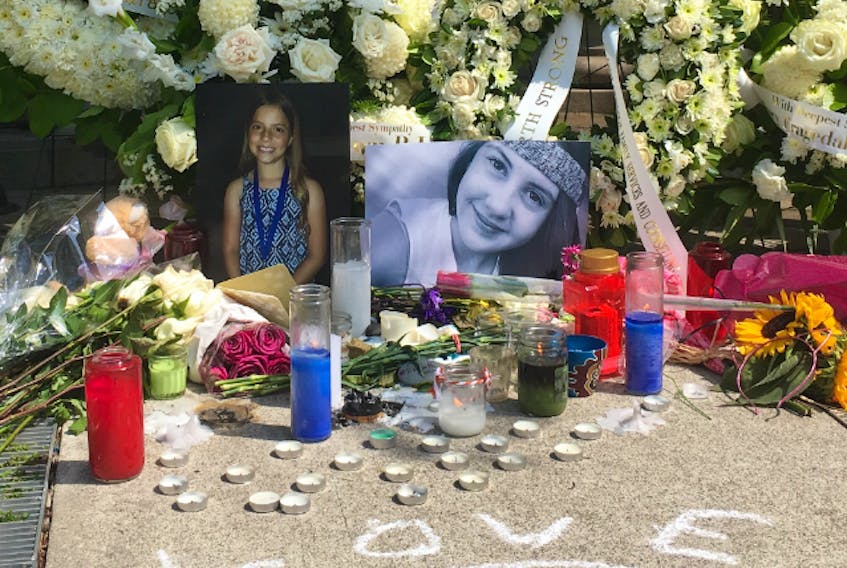  Julianna Kozis, 10, (left) and Reese Fallon, 18, whose images are seen here at a memorial on the Danforth, were killed and 13 others wounded when a gunman went on a shooting rampage in Greektown on Sunday, July 22, 2018. (Chris Doucette/Toronto Sun)