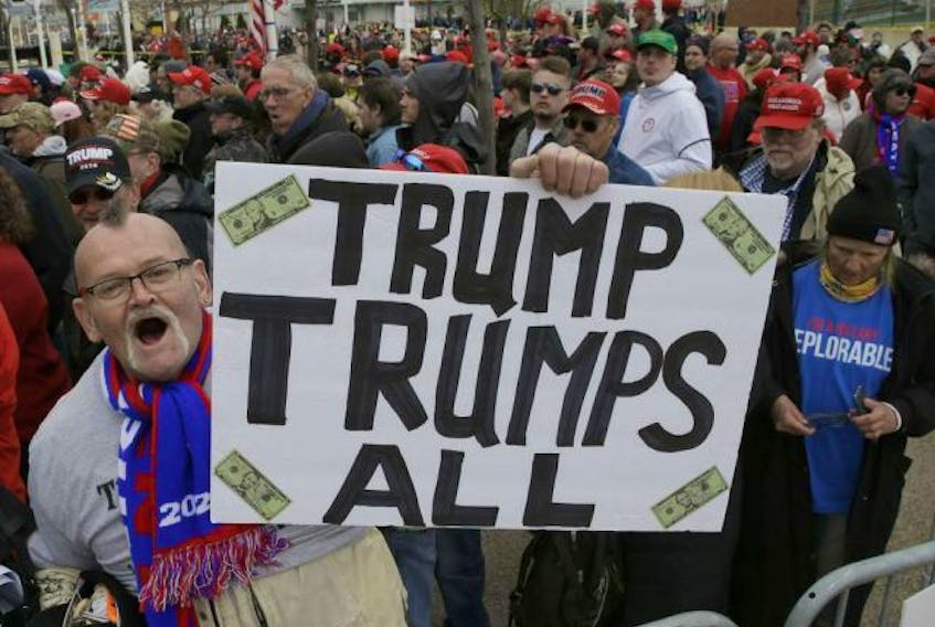 Donald Trump supporter, Jammer Batzler, shows his support at a recent rally in Green Bay, Wis.


