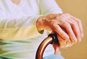 A stock image of the hands of an elderly woman in a long-term care facility.