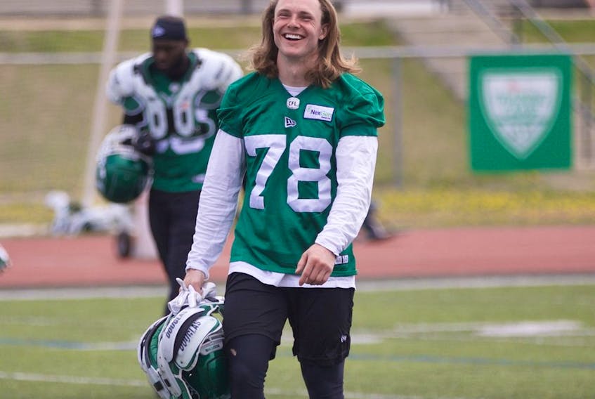 Colton Holmes (number 78), a Saskatoon Hilltops and Aden Bowman Collegiate alum, practiced at Saskatchewan Roughrider training camp at Griffiths Stadium on May 23, 2019.