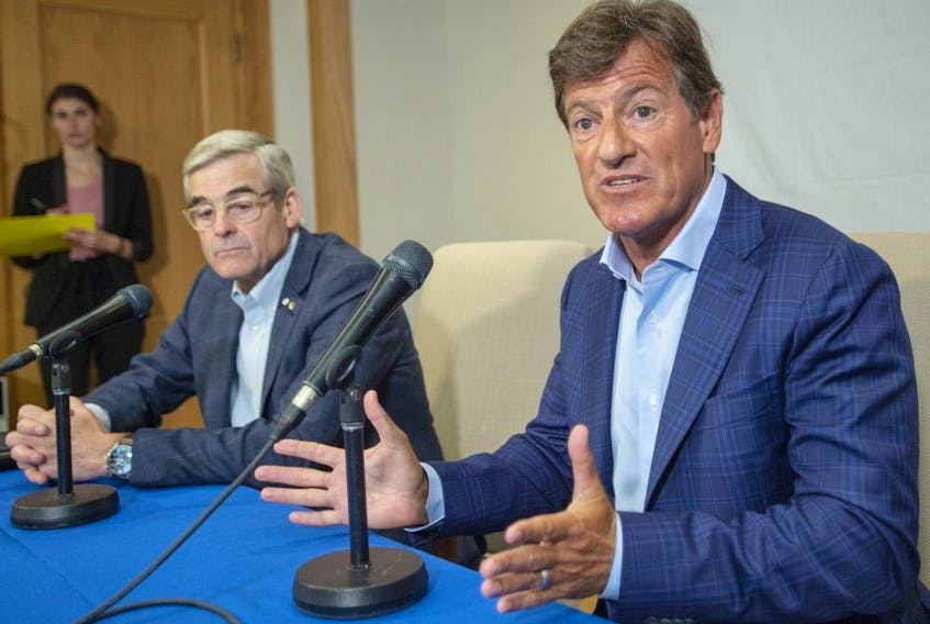 Stephen Bronfman, right, and Pierre Boivin, along with Baseball Montreal are working on a deal to have the Tampa Bay Rays play half their home games in Florida and the other half in Montreal.