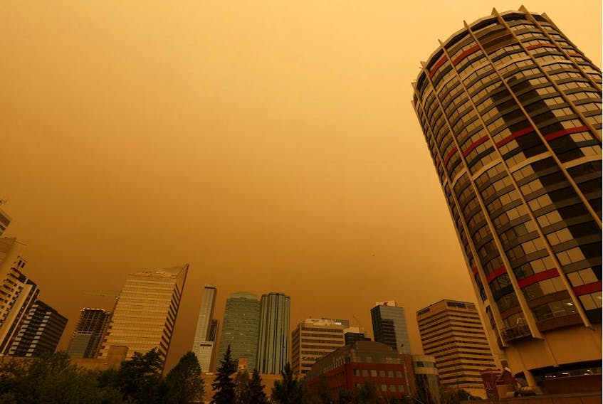 Wildfire smoke is seen in the air in downtown near Edmonton House as an Environment Canada air quality warning is issued in Edmonton, on Thursday, May 30, 2019. 
