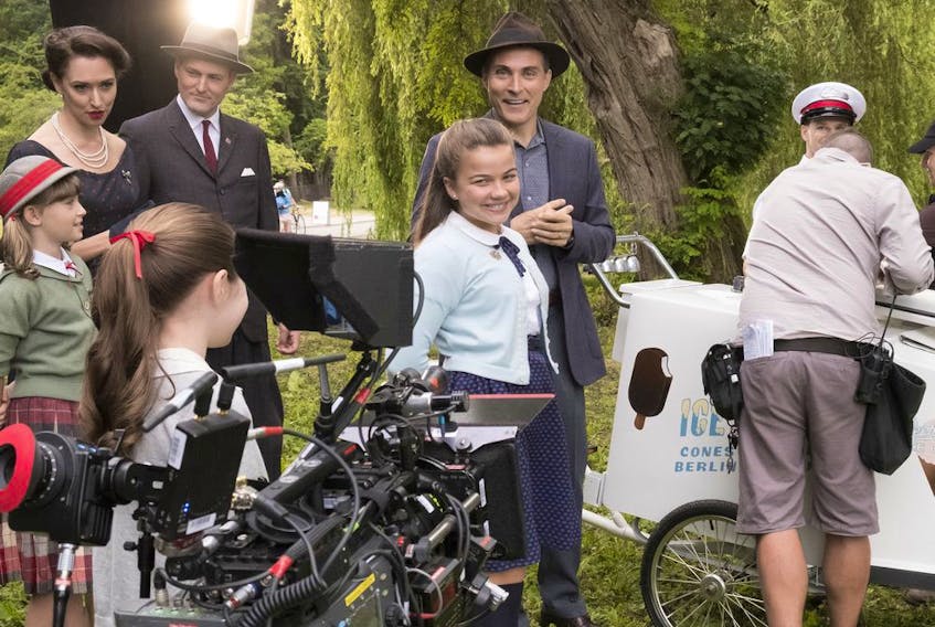 Cast and crew enjoy a light moment on the set of The Man in the High Castle. The production company is now suing its accountant, claiming misappropriation of more than $900,000.