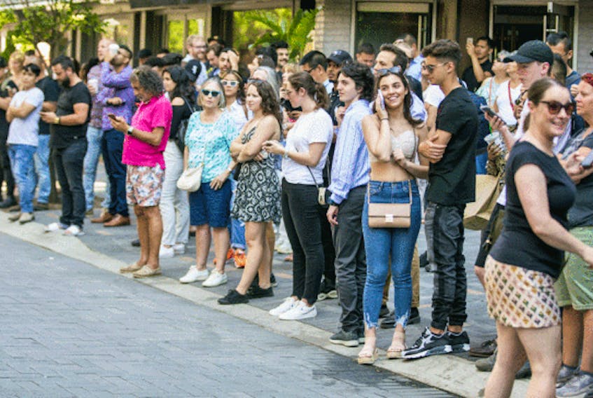  Fans gather across the street from Hazleton Hotel in Toronto’s Yorkville neighbourhood on Wednesday July 3, 2019, in hopes that Kawhi Leonard may be inside.