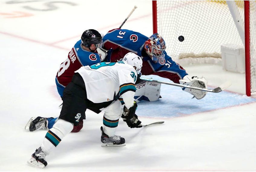 San Jose Sharks sniper Logan Couture scores his first of three goals on the night in a 4-2 victory over the Colorado Avalanche last night at Pepsi Center in Denver.