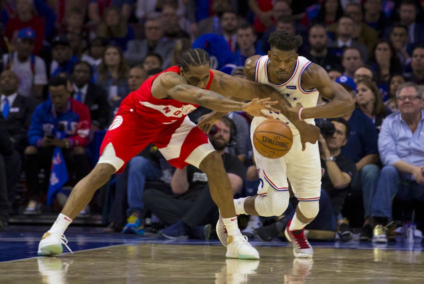  Kawhi Leonard of the Toronto Raptors and Jimmy Butler of the Philadelphia 76ers fight for the ball in the fourth quarter of Game 4 of the Eastern Conference semifinal at the Wells Fargo Center on May 5, 2019 in Philadelphia, Pennsylvania. The Raptors defeated the 76ers 101-96.  (Photo by Mitchell Leff/Getty Images)
