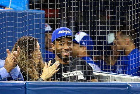 Kawhi Leonard of the Toronto Raptors watches a MLB game between the Los Angeles Angels of Anaheim and the Toronto Blue Jays at Rogers Centre on June 20, 2019 in Toronto, Canada. 