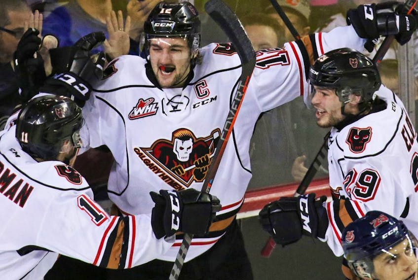 The Calgary Hitmen's Mark Kastelic celebrates after scoring on Lethbridge Hurricanes goaltender Carl Tetachuk late in the third to move the Hitmen ahead of the Hurricanes in their WHL playoff game in Calgary on Sunday, March 31, 2019. The Hurricanes went on to score in OT to stretch the series to a seventh game. Gavin Young/Postmedia