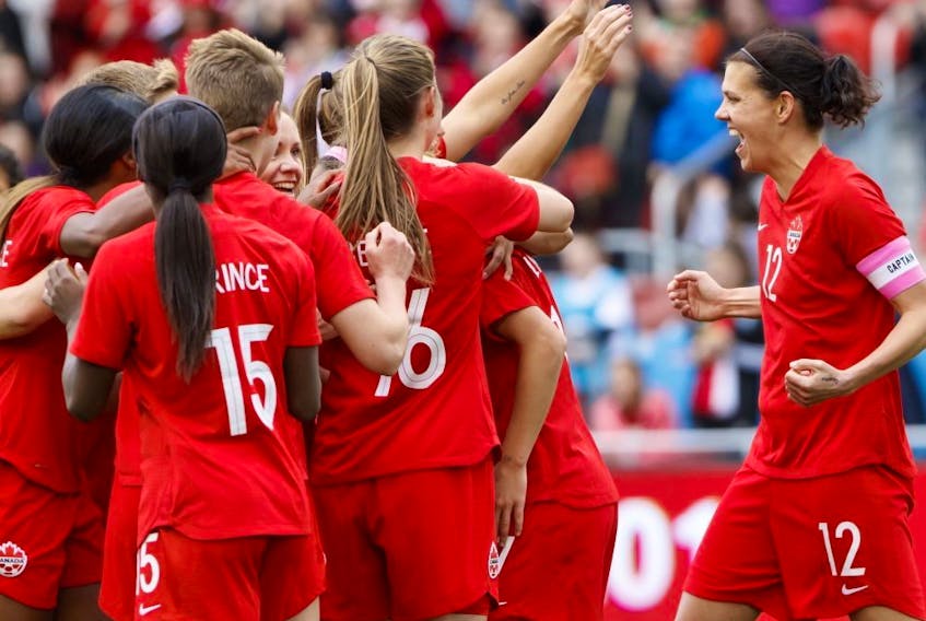 Team Canada captain Christine Sinclair (12) celebrates a goal by midfielder Jessie Fleming (17) during the first half of a women's international soccer friendly against Mexico at BMO field in Toronto, Saturday, May 18, 2019. 