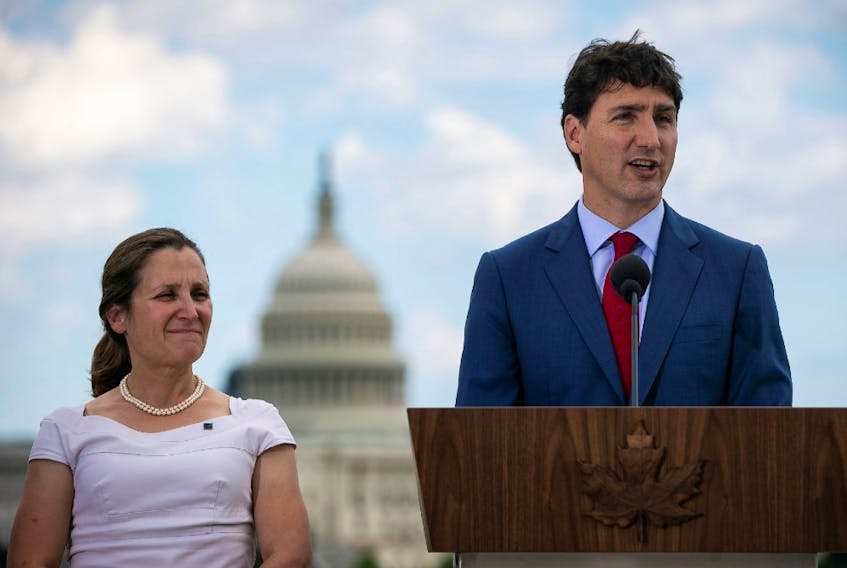  Canada’s Prime Minister Justin Trudeau speaks as Canada’s Foreign Minister Chrystia Freeland listens during a news conference at the Canadian Embassy, in Washington, U.S. June 20, 2019. Freeland and Trudeau have been criticized by former ambassadors for prioritzing romanticism over realism.