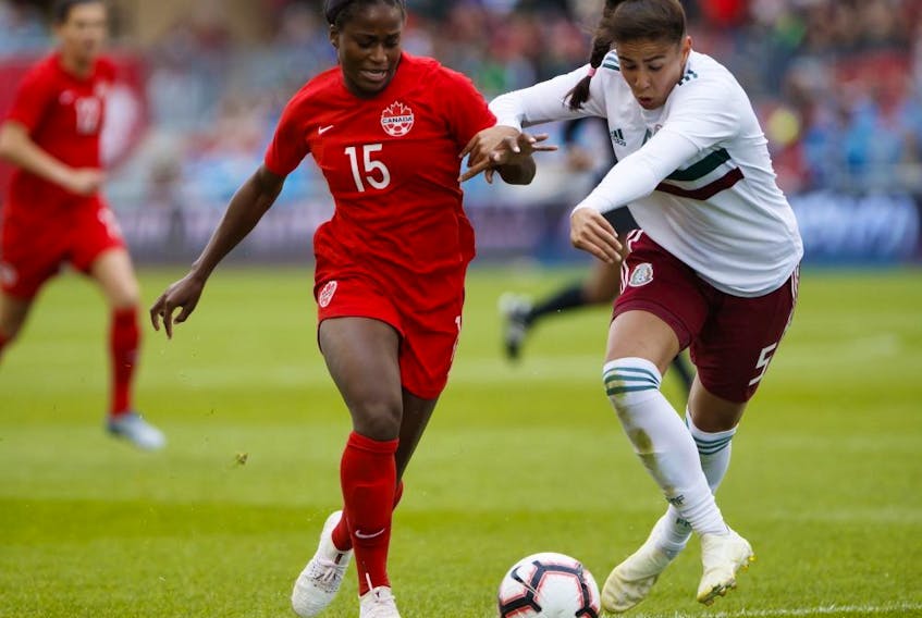 Team Mexico's defender Jimena Lopez vies for the ball from Team Canada's Nichelle Prince (15) during the first half of a women's international soccer friendly against Mexico at BMO Field in Toronto, Saturday, May 18, 2019. 