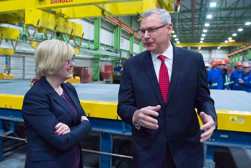 Irving Shipbuilding president Kevin McCoy, right, and Public Services Minister Carla Qualtrough chat at a ceremony where the first piece of steel was cut on the third Arctic patrol vessel for the Royal Canadian Navy, in Halifax on Tuesday, Dec. 19, 2017. Irving is building five to six Arctic patrol vessels under Ottawa's national shipbuilding strategy.