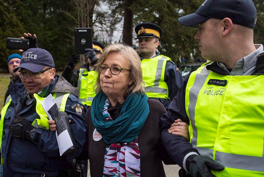  Elizabeth May is arrested after joining a protest outside Kinder Morgan’s facility in Burnaby, B.C., on March 23, 2018.