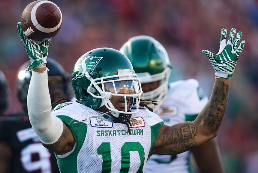 Tre Mason and the Saskatchewan Roughriders celebrate a 29-24 victory over the host Calgary Stampeders.