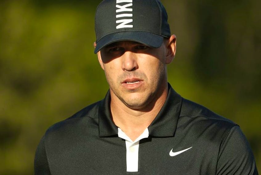 Brooks Koepka of the United States reacts to his putt during the third round of the 2019 PGA Championship at the Bethpage Black course on May 18, 2019 in Farmingdale, New York.