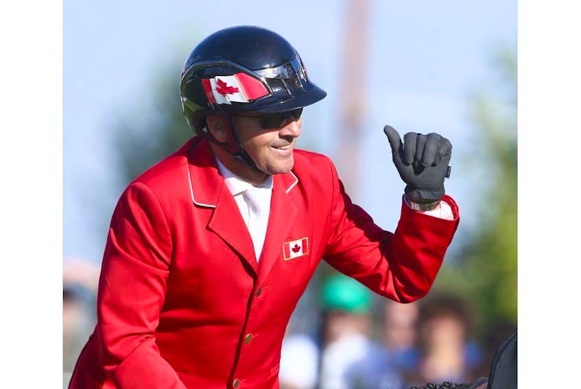 Eric Lamaze, from Canada, celebrates his clear second round on horse Coco Bongo in the Nations' Cup during the Masters at Spruce Meadows in Calgary on Saturday, September 8, 2018. The Nations' Cup was won by Germany and Canada finished second. Jim Wells/Postmedia