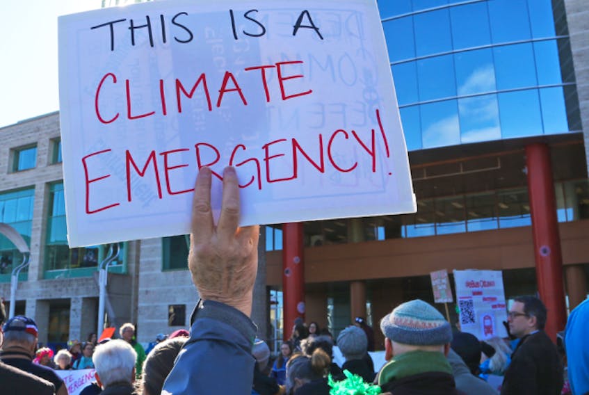 Ottawa residents rally outside Ottawa City Hall to demonstrate support for a motion to declare a climate emergency, April 16, 2019.