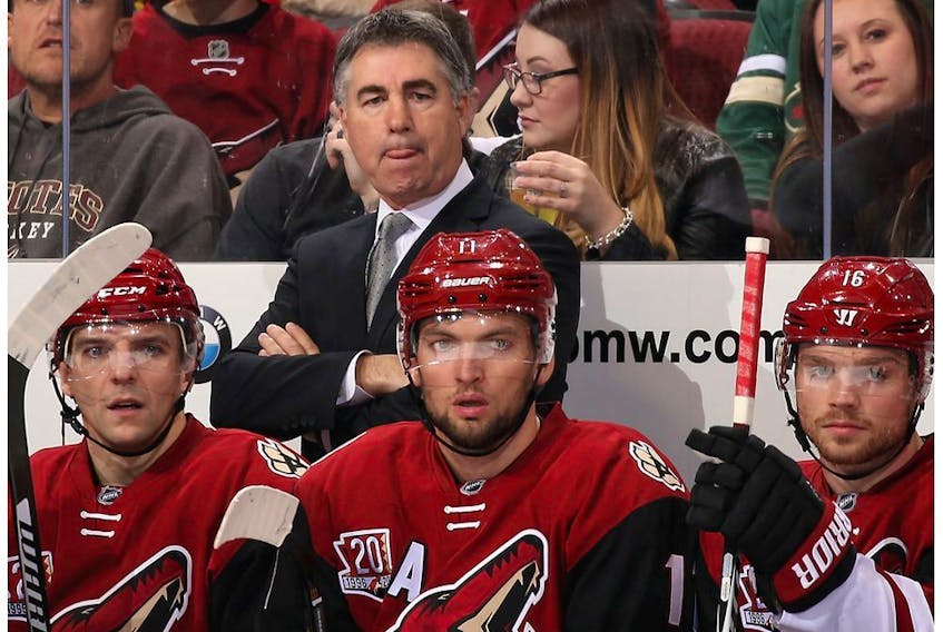 Head coach Dave Tippett of the Arizona Coyotes watches from the bench during the first period of the NHL game against the Vancouver Canucks at Gila River Arena on November 23, 2016 in Glendale, Arizona.