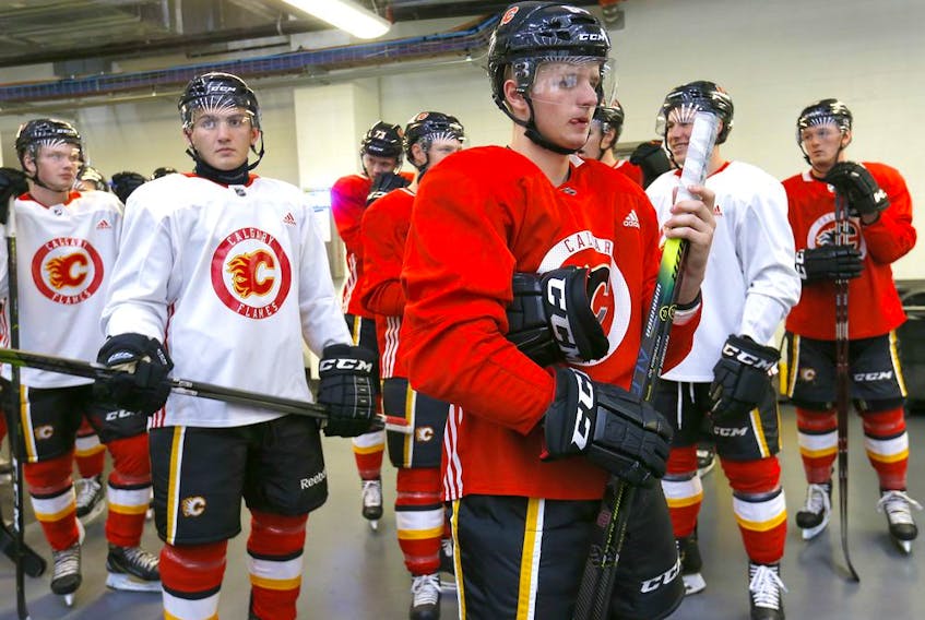 Calgary Flames, Emilio Pettersen and gang get ready to hit the ice during the Flames annual development camp at WinSport Canada in Calgary on Saturday, July 6, 2019. 