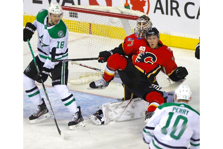 Calgary Flames, Mark Jankowski  battles Dallas Stars, Corey Perry in first period action of at the Scotiabank Saddledome in Calgary on Wednesday, November 13, 2019. Darren Makowichuk/Postmedia