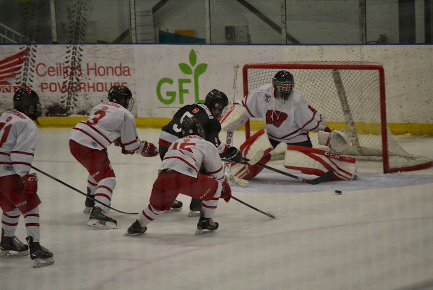 The Western Hurricanes faced off against the Wear Well Bombers on Oct. 21, defeating the Pictou County team 4-3 in a shootout win on the road. Here, Andre d’Entremont, left, Waylen Coleman and Ryan O’Callaghan chase after Blaise MacDonald of the Wear Well Bombers as he rushes the net in an attempt to score on goalie Jeremy Charles. - SUBMITTED