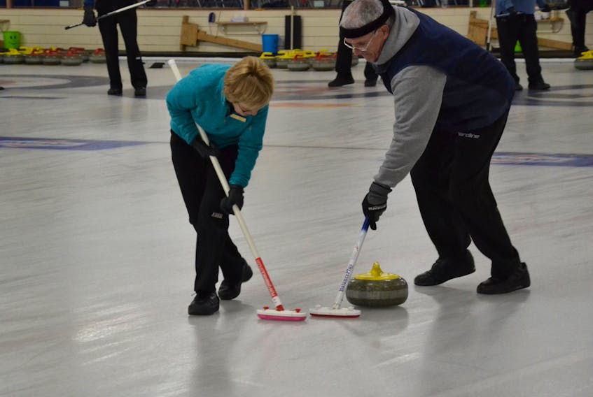 SUMMERSIDE - Sports and leisure competitions were in full swing Tuesday, as the 2020 Vogue Optical P.E.I. 55+ Winter Games continued in Summerside. Joanne Durant, left, and Eugene Murphy of the Cornwall Curling Club hurried hard down the ice at the Silver Fox as part of the action. 
Hockey, walking and crokinole were also underway in the morning, with darts, skating and men's doubles pickleball competitions on deck for the afternoon of Feb. 25.
The games are organized in communities across the Island in the summer and winter and foster an active lifestyle for older adults.
Swimming, bowling, table tennis, various card and board games and 8-ball pool are scheduled throughout the week.
Hélène Moase/Journal Pioneer
