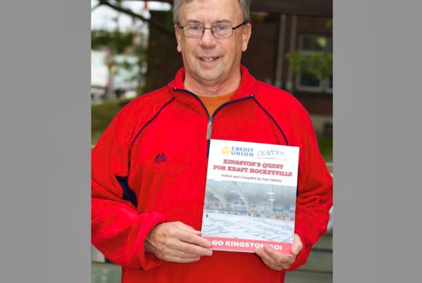 Kingston resident Don Hyslop with an advance copy of his book, Kingston for Kraft Hockeyville 2014 quest.