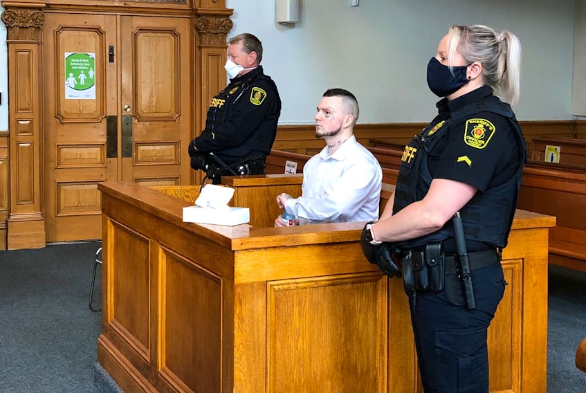 Justin Wiseman, 28, awaits the start of his sentencing hearing in Newfoundland and Labrador Supreme Court in St. John's Tuesday morning. Wiseman has been convicted of armed robbery and arson charges related to a day-long crime spree in March 2018 that ended with him being removed from a burning Mount Pearl home by police.